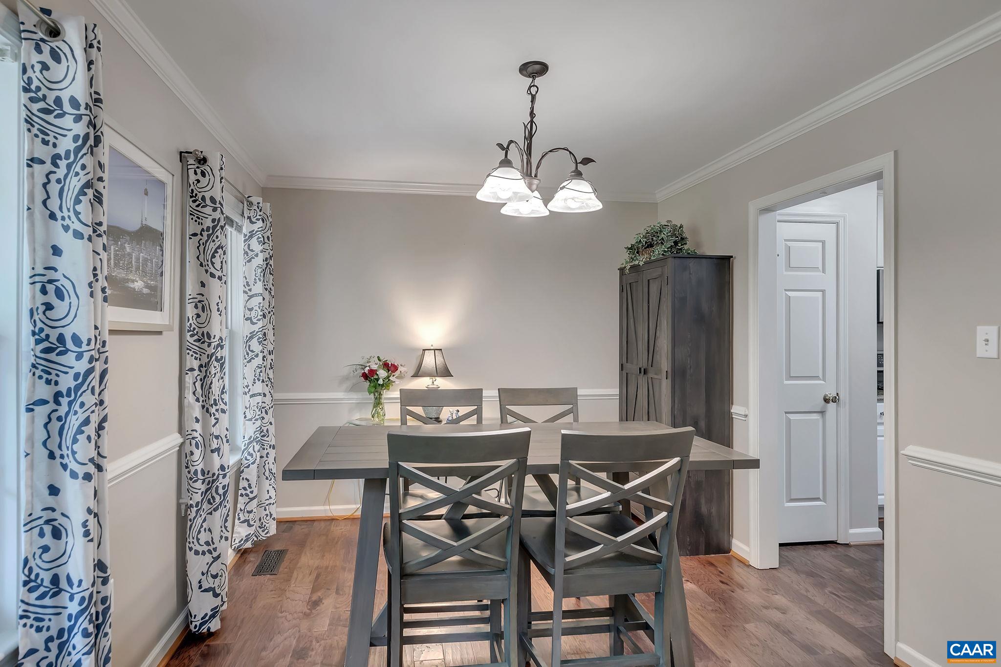 460 Northridge Road Ruckersville, VA 22968 - Photo 9 of 40 a view of a dining room with furniture wooden floor and chandelier