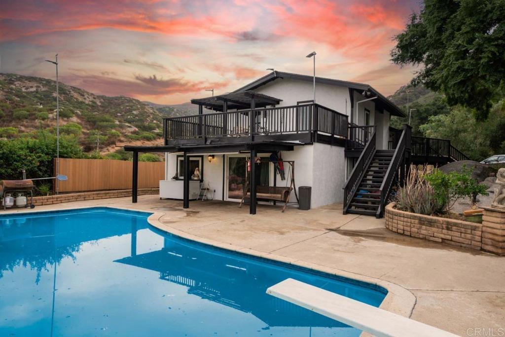 504 Josh Way Alpine, CA 91901 - Photo 1 of 1 a view of a house with swimming pool and sitting area