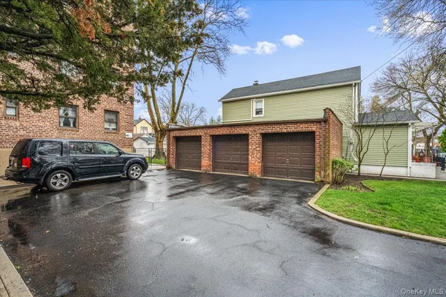 a view of a car parked in front of a house