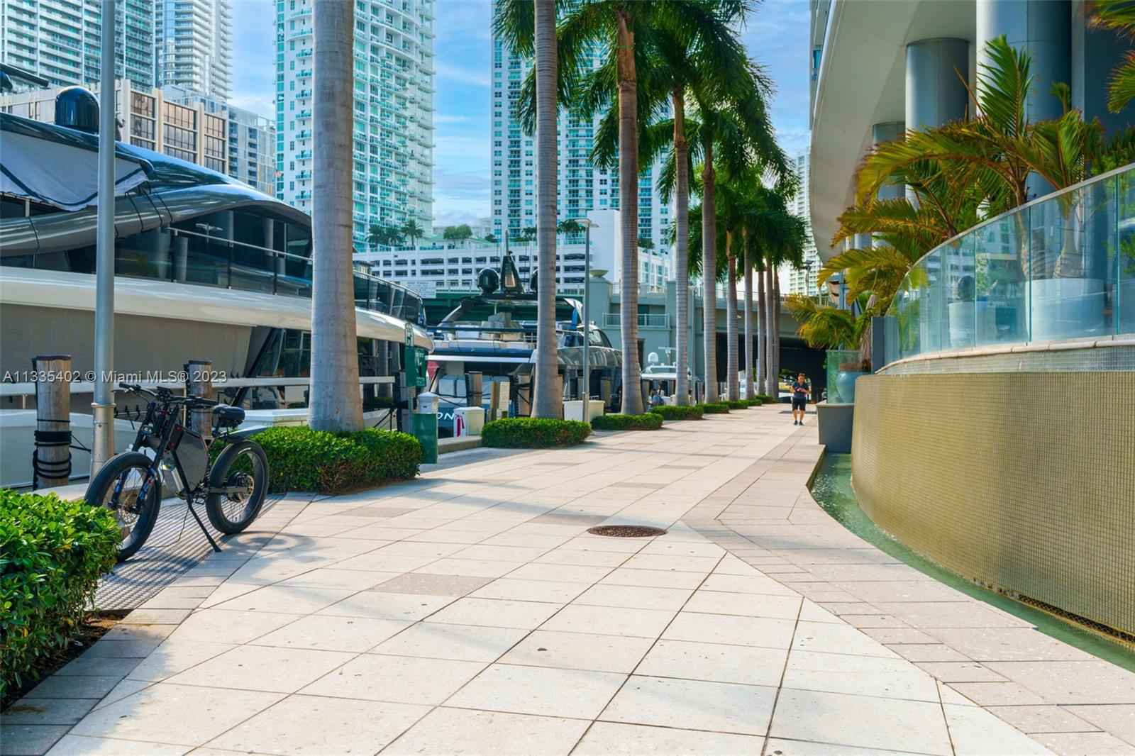200 Biscayne Blvd Way, Unit 1404 Miami, FL 33131 - Photo 32 of 32 a view of a backyard with potted plants and palm trees