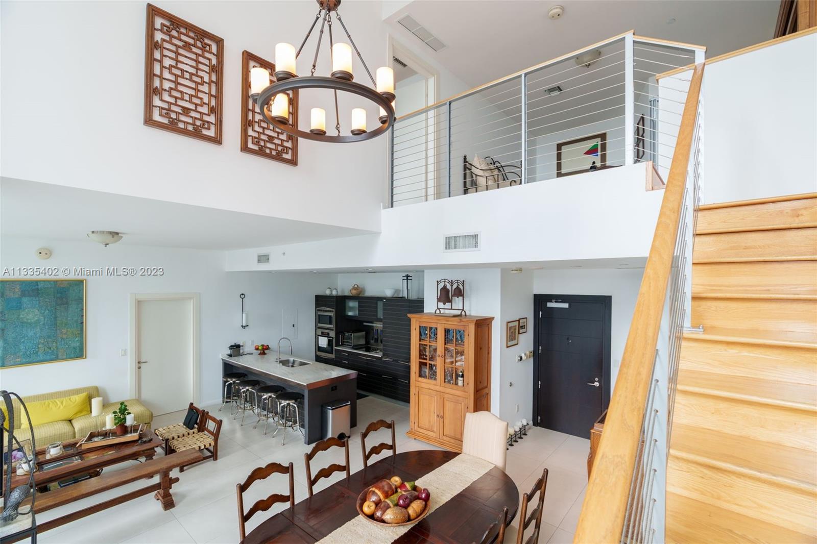 200 Biscayne Blvd Way, Unit 1404 Miami, FL 33131 - Photo 9 of 32 a view of a livingroom with furniture and a flat screen tv
