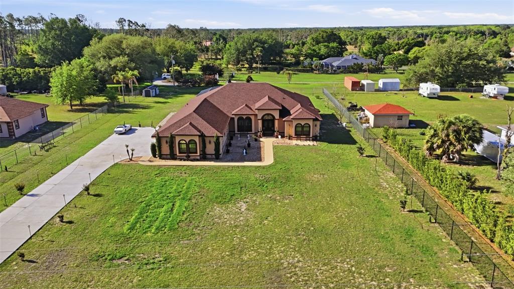 13429 Montevista Road Clermont, FL 34711 - Photo 79 of 89 an aerial view of a house with big yard
