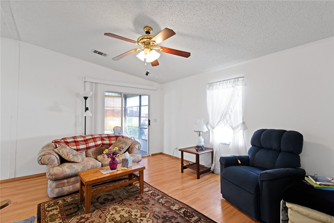 7571 Boxelder Road Micco, FL 32976 - Photo 13 of 36 a living room with furniture and a large window