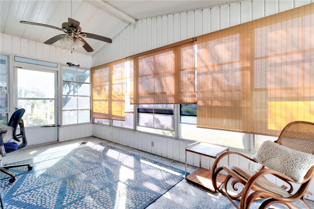 7571 Boxelder Road Micco, FL 32976 - Photo 21 of 36 a living room with furniture and a large window
