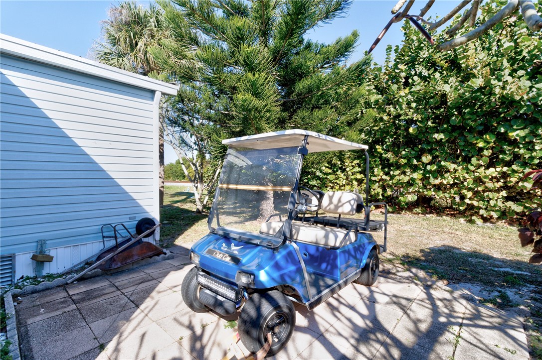 7571 Boxelder Road Micco, FL 32976 - Photo 22 of 36 a view of a patio with furniture