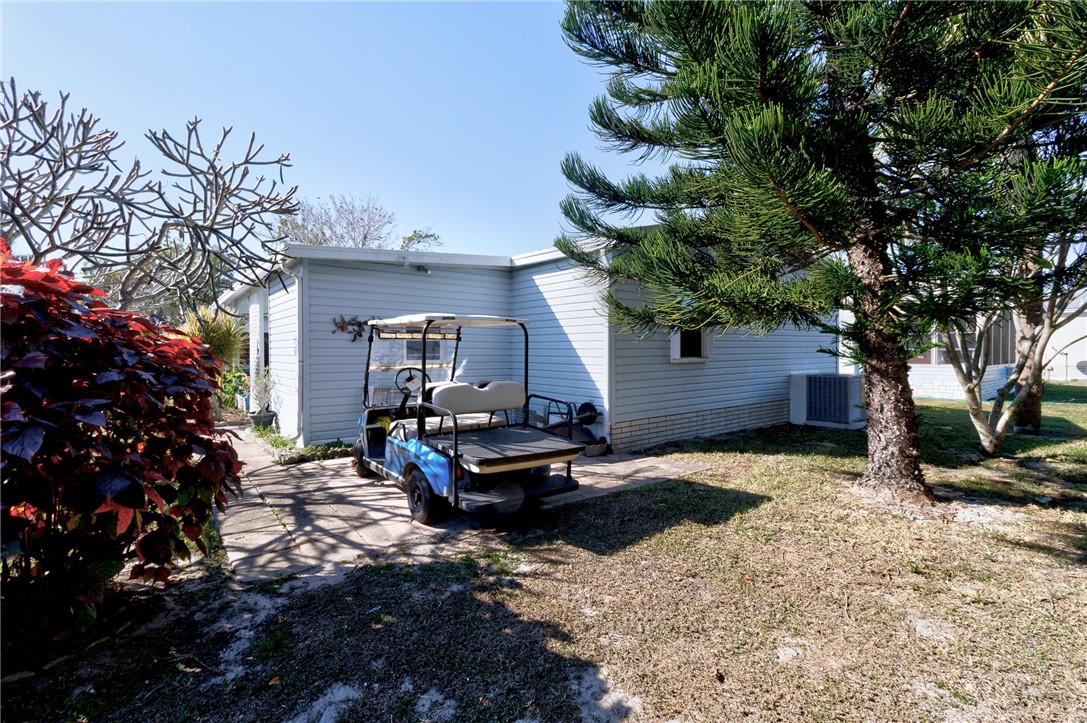 7571 Boxelder Road Micco, FL 32976 - Photo 23 of 36 a view of a house with a yard