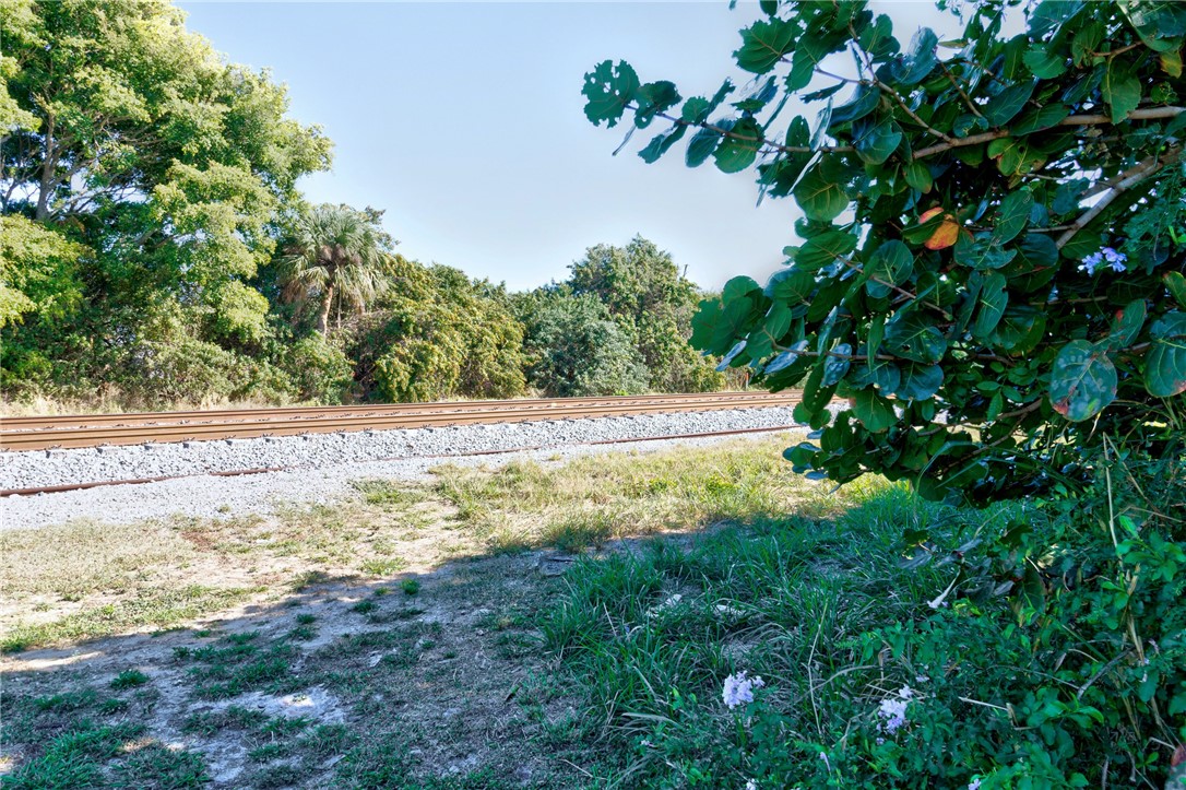 7571 Boxelder Road Micco, FL 32976 - Photo 28 of 36 a view of a yard with a tree