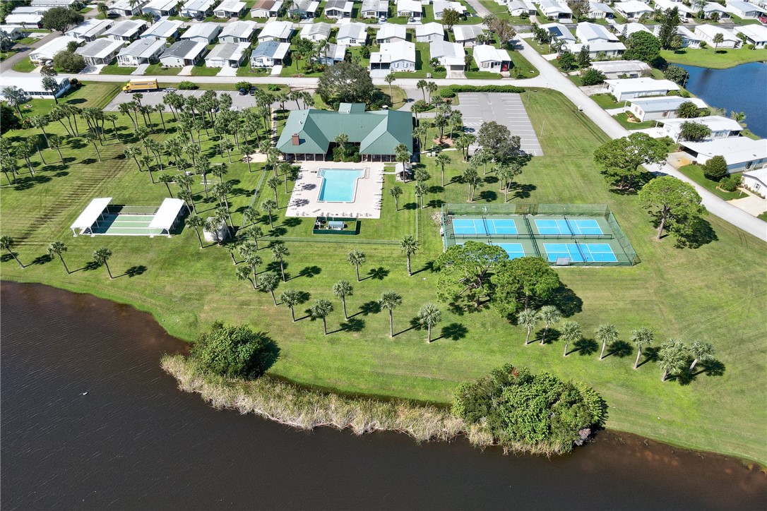 7571 Boxelder Road Micco, FL 32976 - Photo 32 of 36 an aerial view of a residential houses with outdoor space and street view