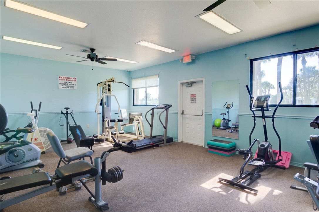 7571 Boxelder Road Micco, FL 32976 - Photo 34 of 36 a view of a room with gym equipment