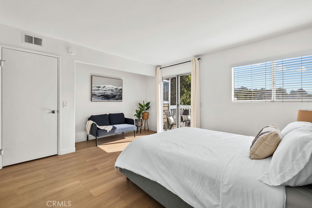 34128 Selva Road, Unit 267 Dana Point, CA 92629 - Photo 30 of 44 a bedroom with a bed couch and a window