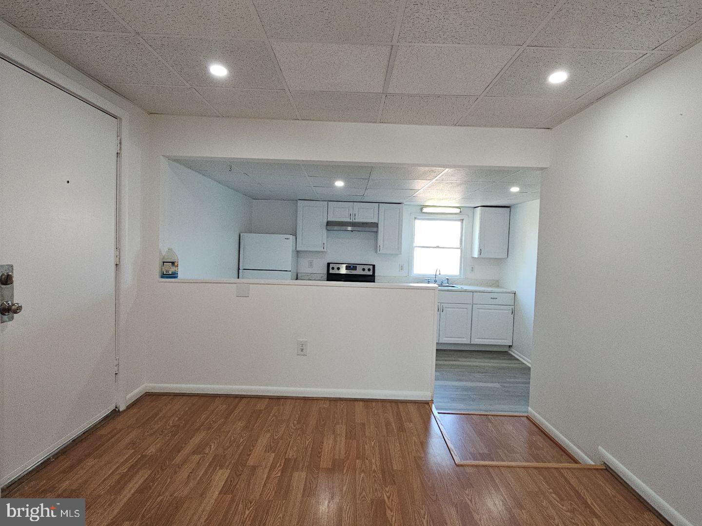 10 East Broad Street, Unit 2 Millville, NJ 08332 - Photo 25 of 33 a view of kitchen with cabinets and wooden floor