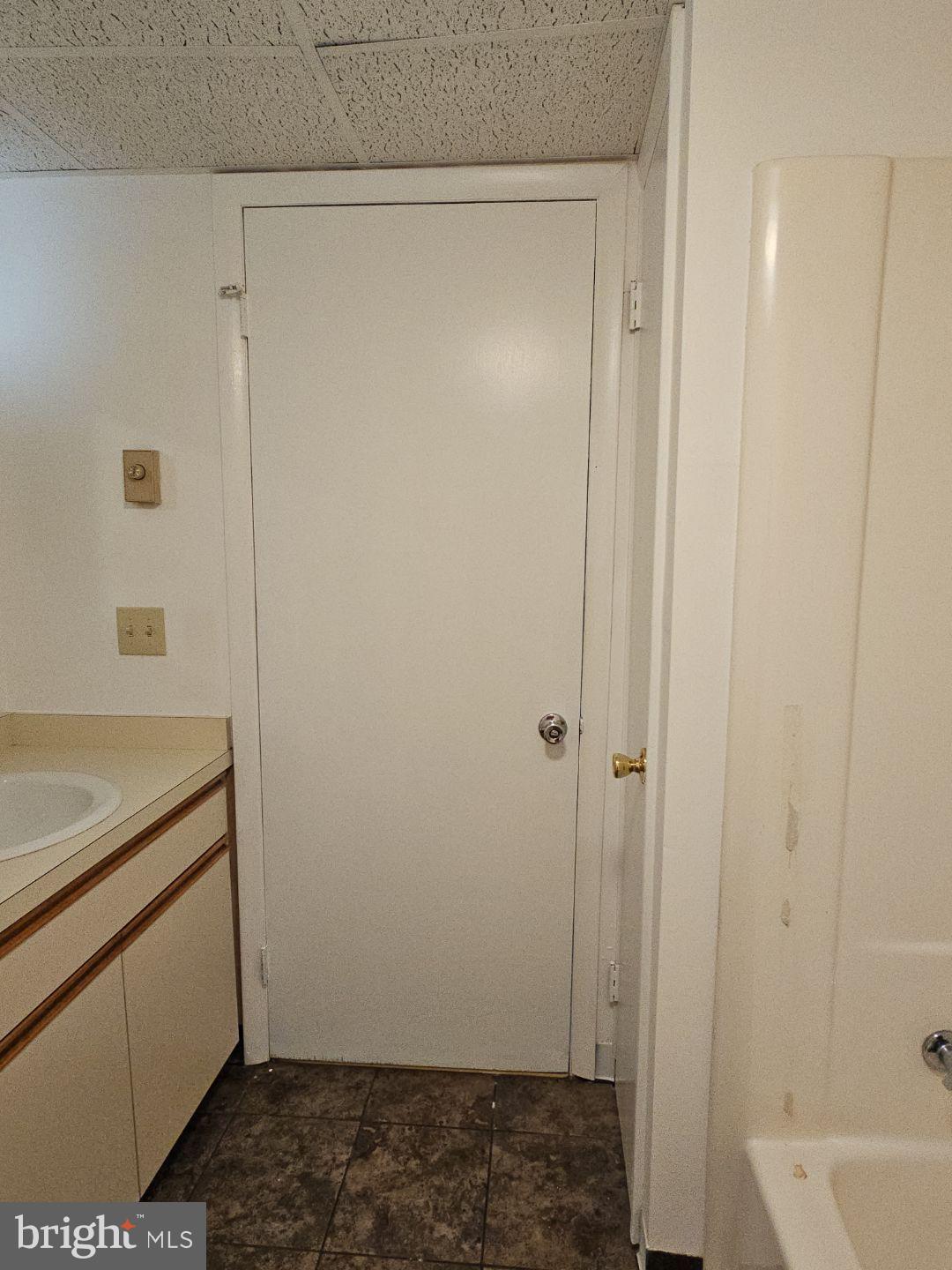 10 East Broad Street, Unit 2 Millville, NJ 08332 - Photo 32 of 33 a bathroom with a sink and a mirror