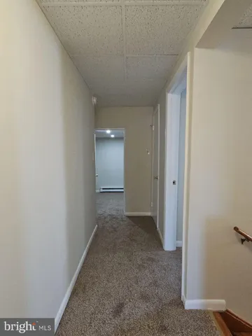 a view of hallway with closet