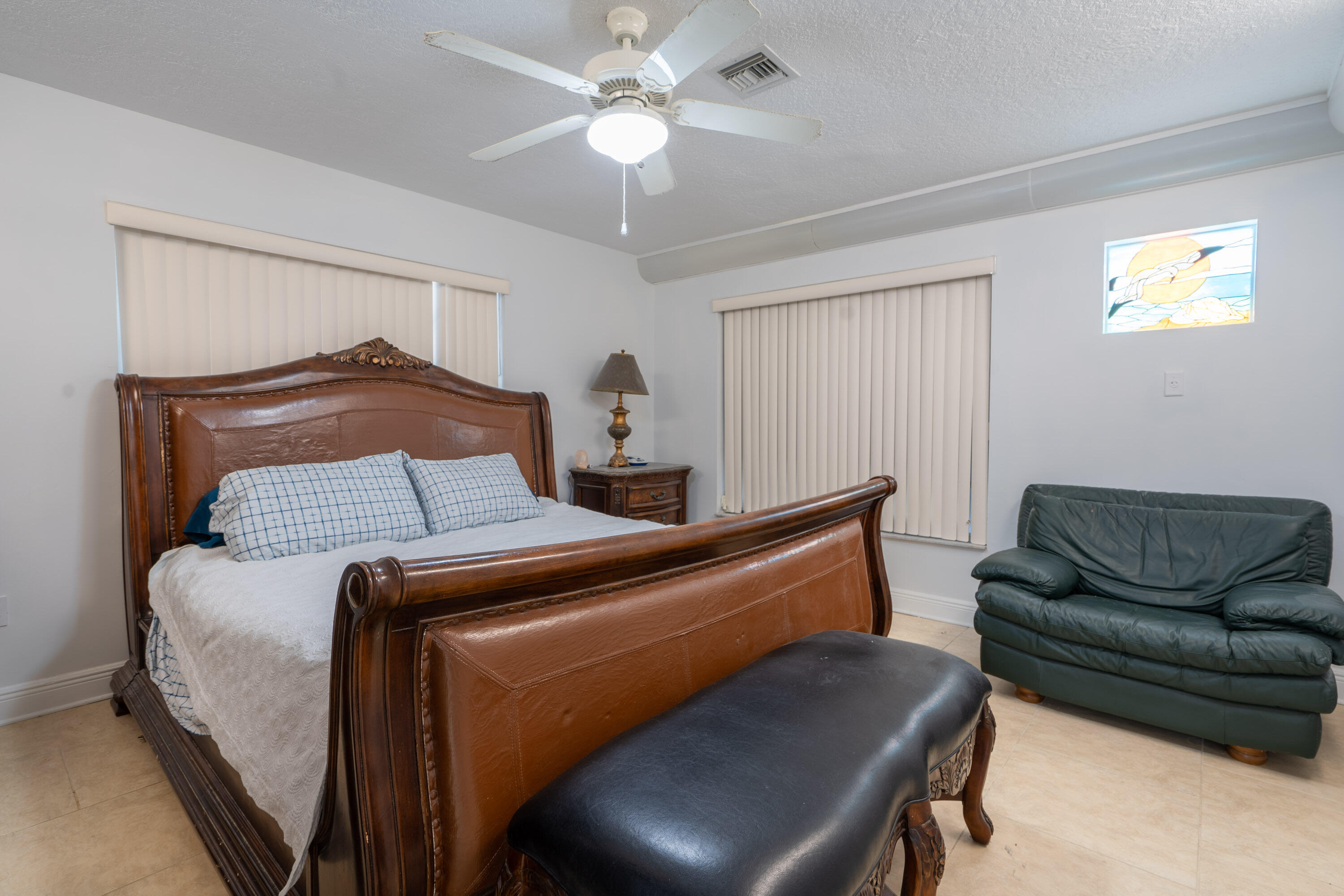 3814 Joyce Road Big Pine Key, FL 33043 - Photo 17 of 40 a bed room with a bed and a couch