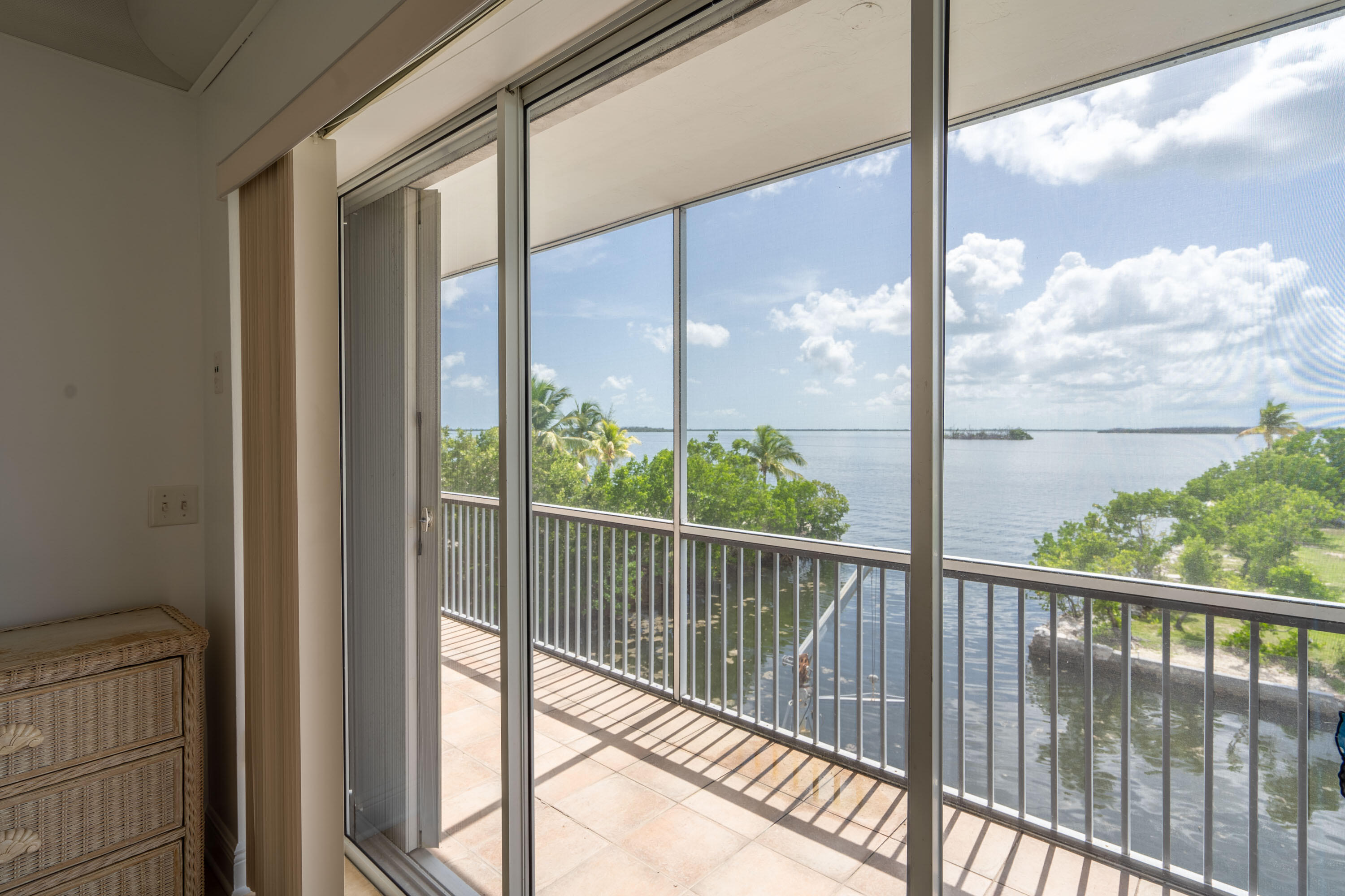 3814 Joyce Road Big Pine Key, FL 33043 - Photo 21 of 40 a view of a glass door with a view of porch with wooden floor