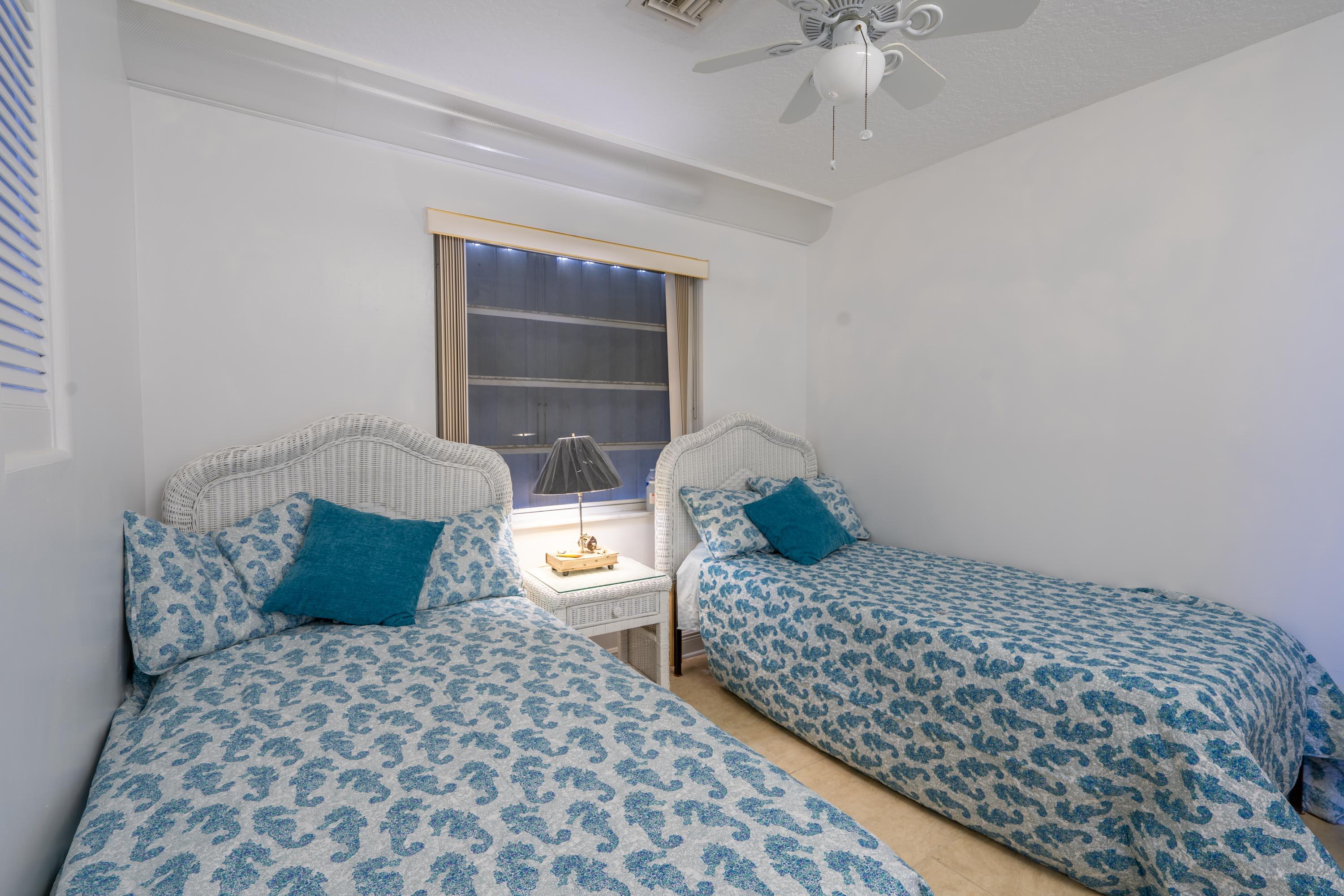 3814 Joyce Road Big Pine Key, FL 33043 - Photo 26 of 40 a bedroom with a bed and a window