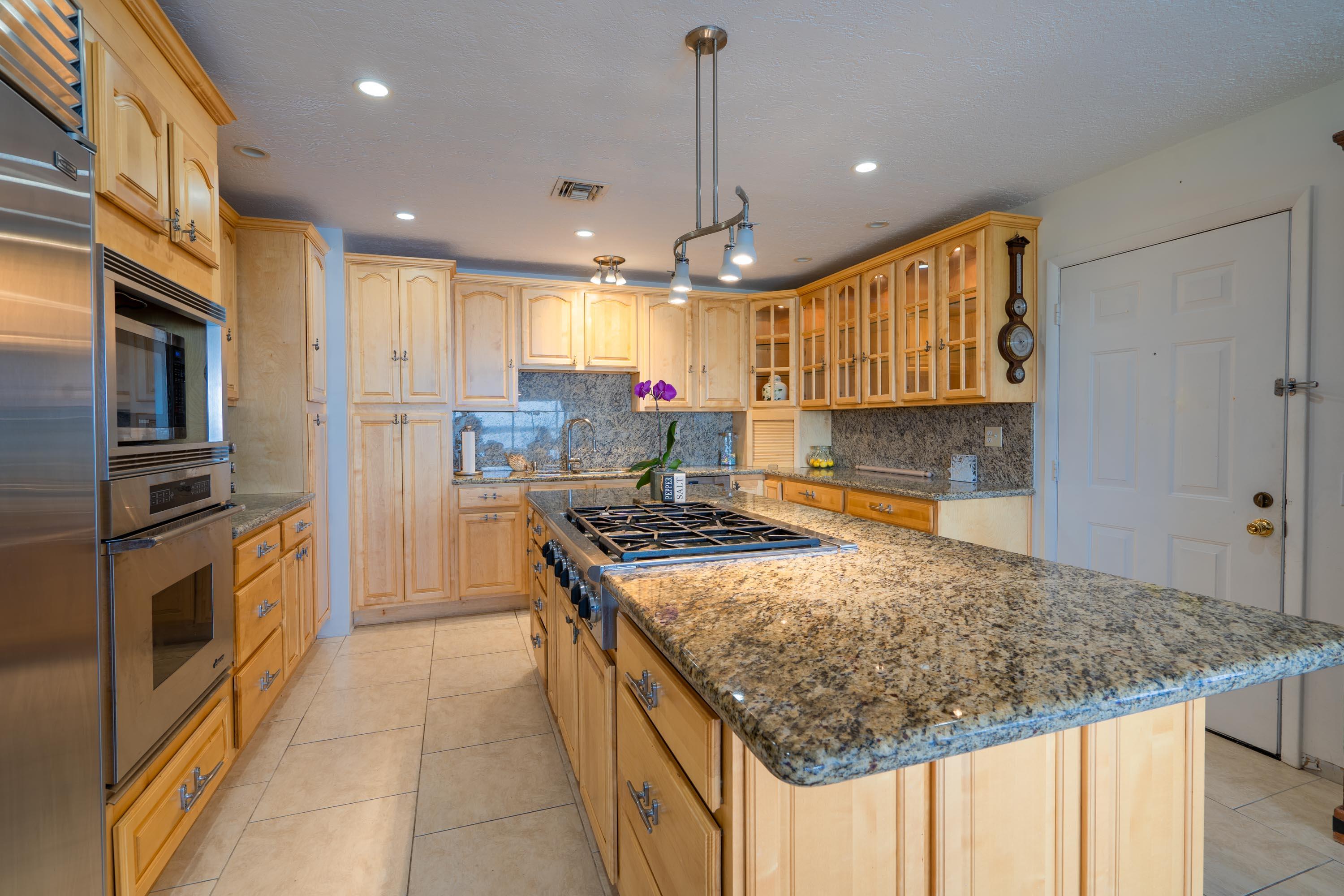 3814 Joyce Road Big Pine Key, FL 33043 - Photo 5 of 40 a kitchen with a stove a sink and a refrigerator