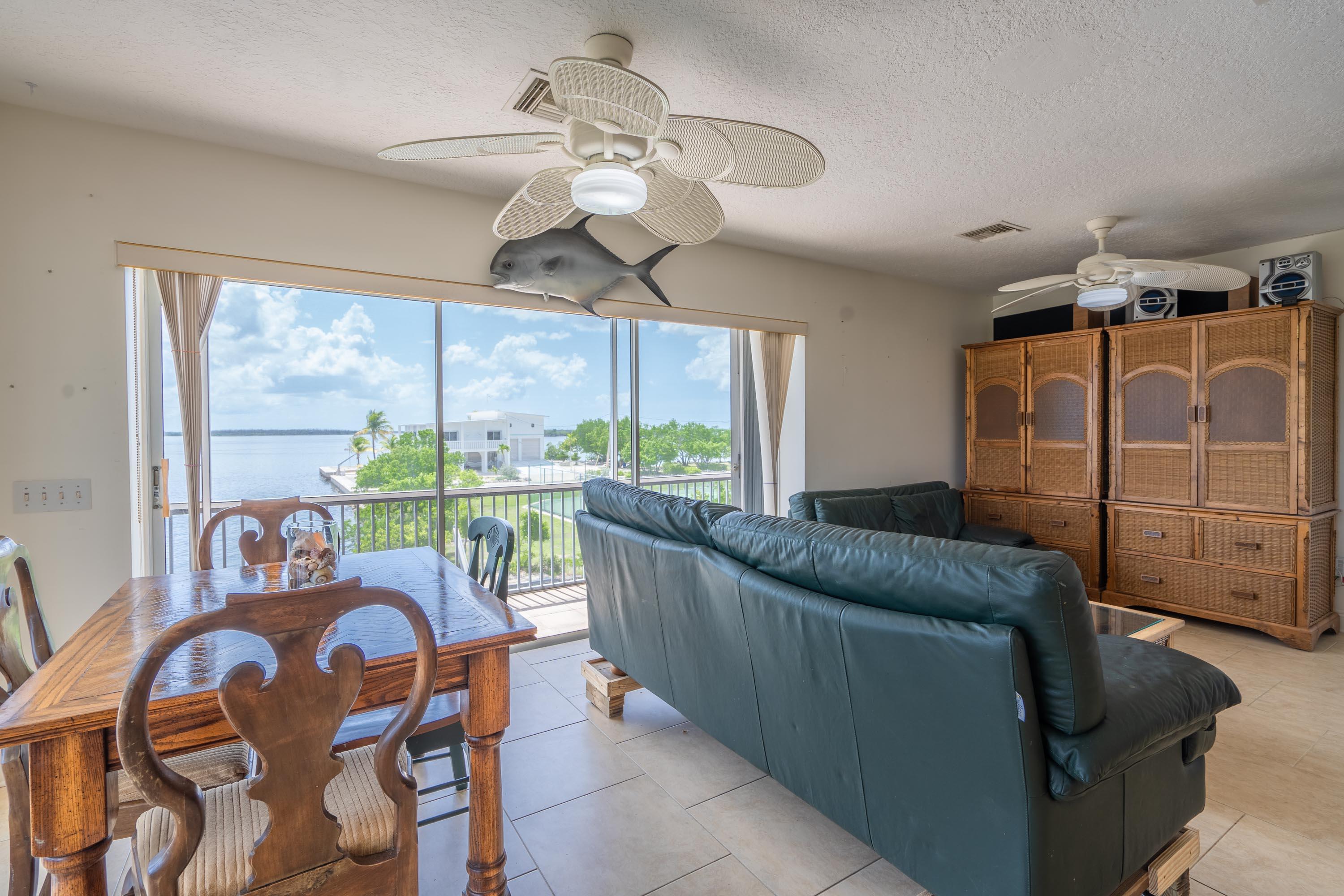 3814 Joyce Road Big Pine Key, FL 33043 - Photo 8 of 40 a living room with furniture and a large window