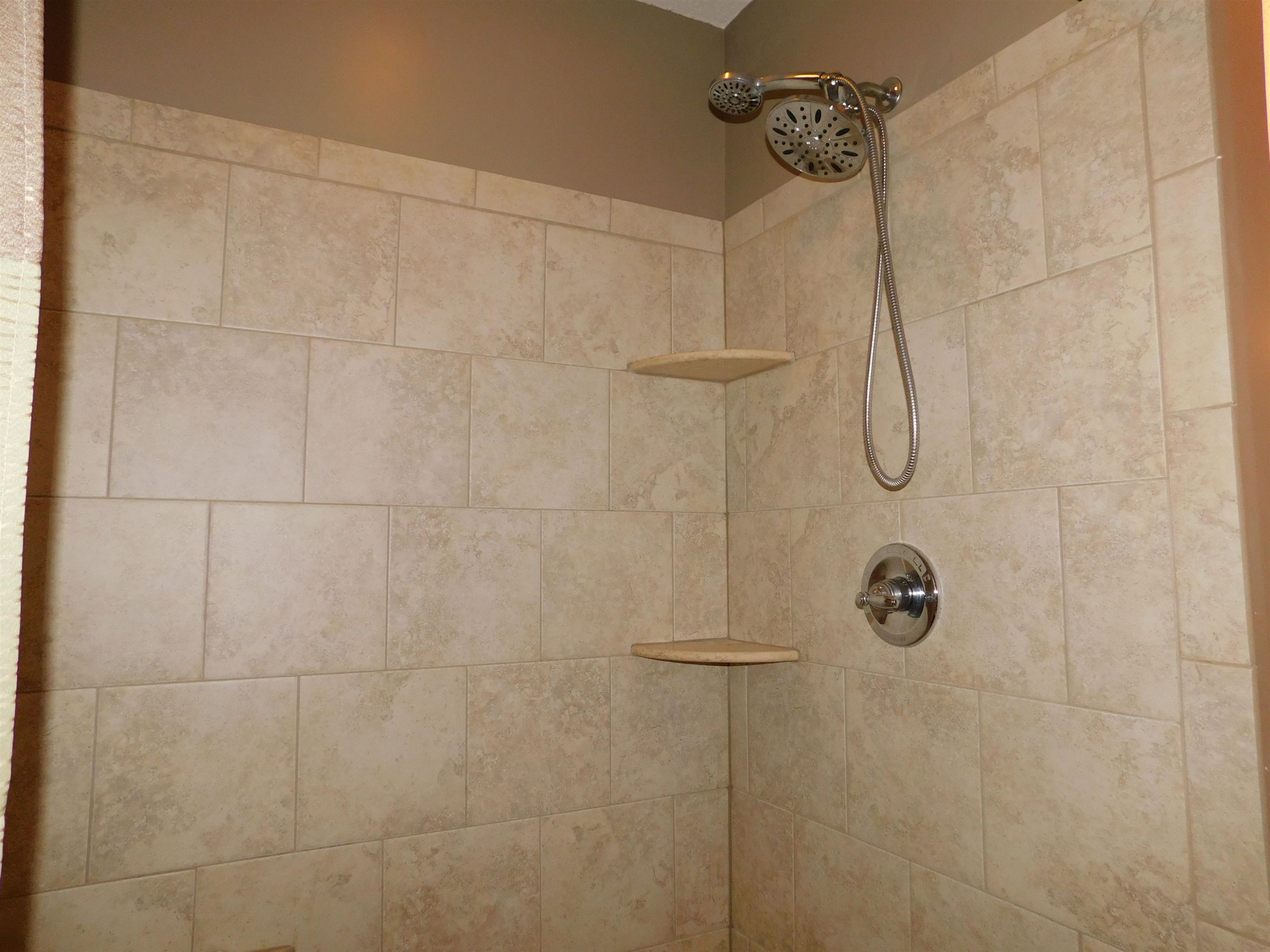 213 Goldfield Drive Garner, NC 27529 - Photo 14 of 18 a bathroom with a shower