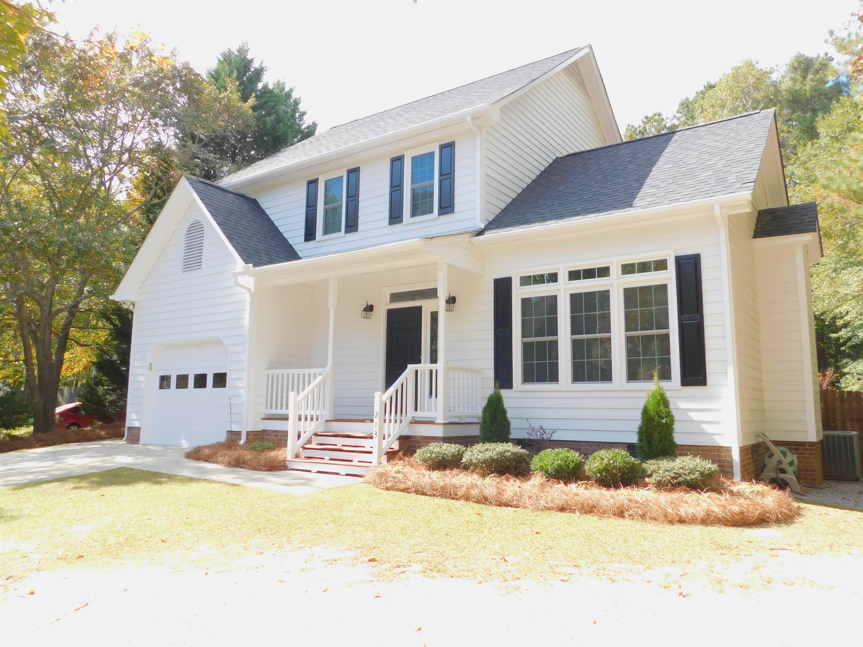 213 Goldfield Drive Garner, NC 27529 - Photo 2 of 18 a front view of a house with a swimming pool
