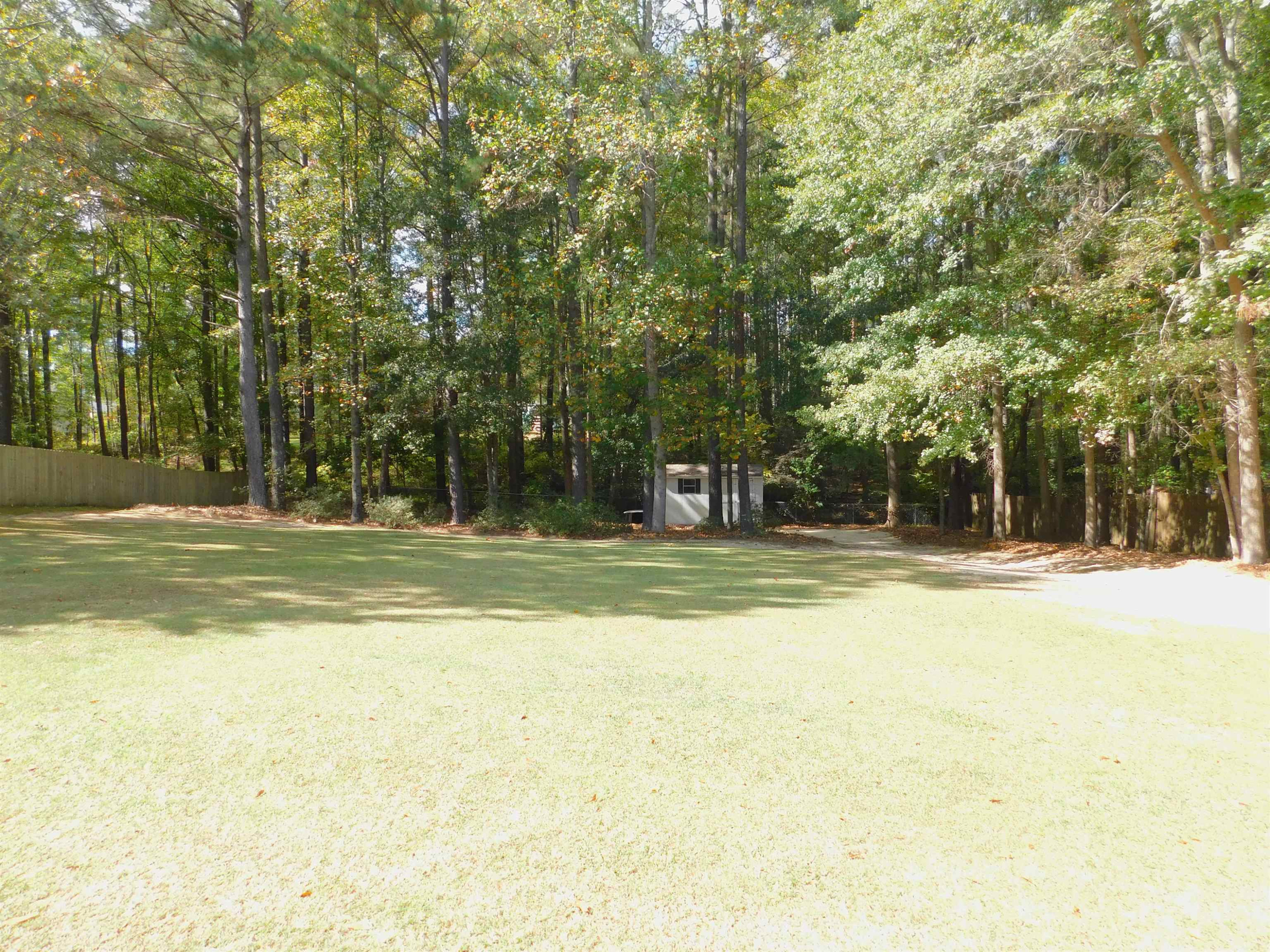 213 Goldfield Drive Garner, NC 27529 - Photo 5 of 18 a view of a house with a large trees