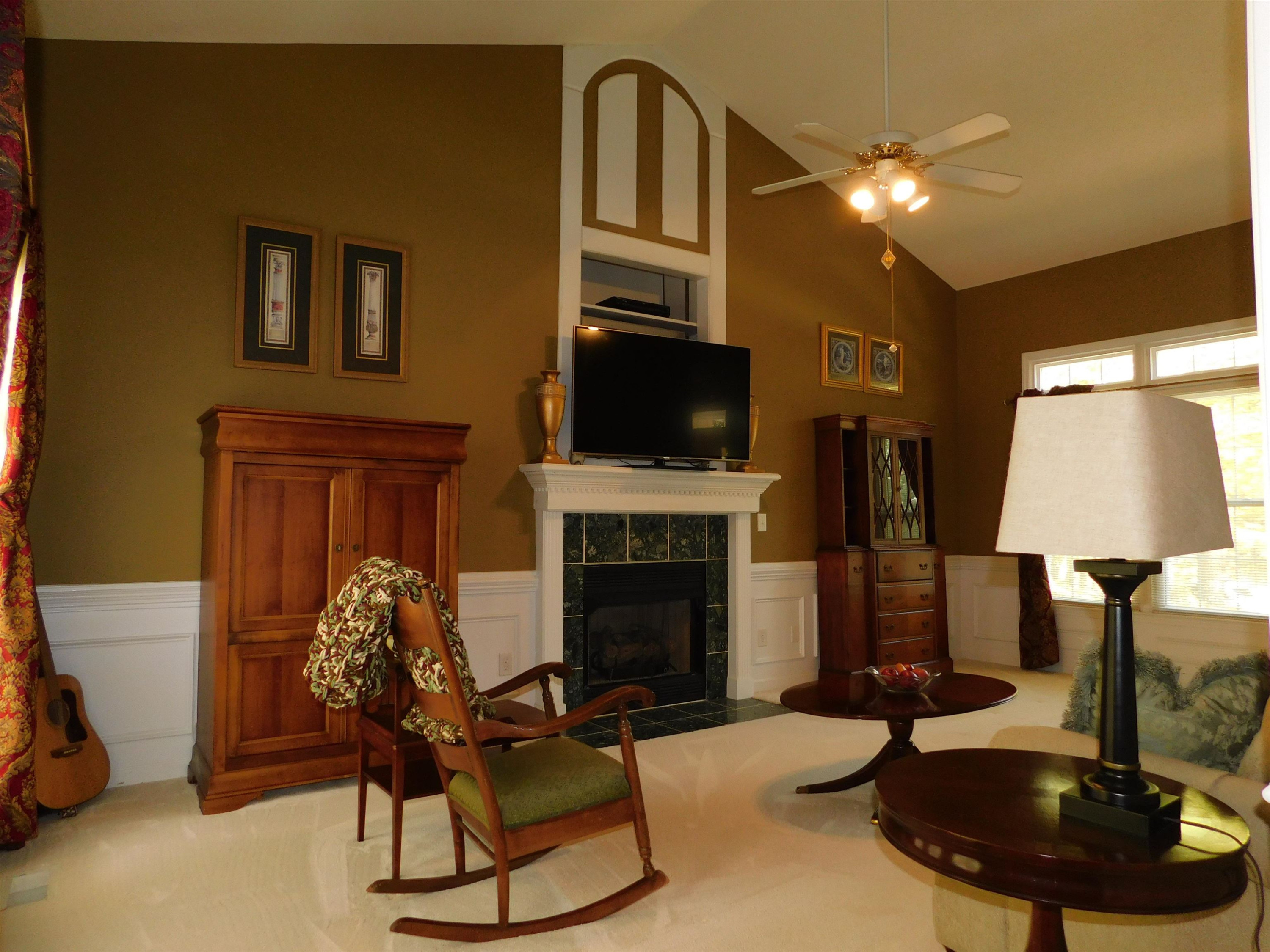 213 Goldfield Drive Garner, NC 27529 - Photo 7 of 18 a living room with furniture and a fireplace