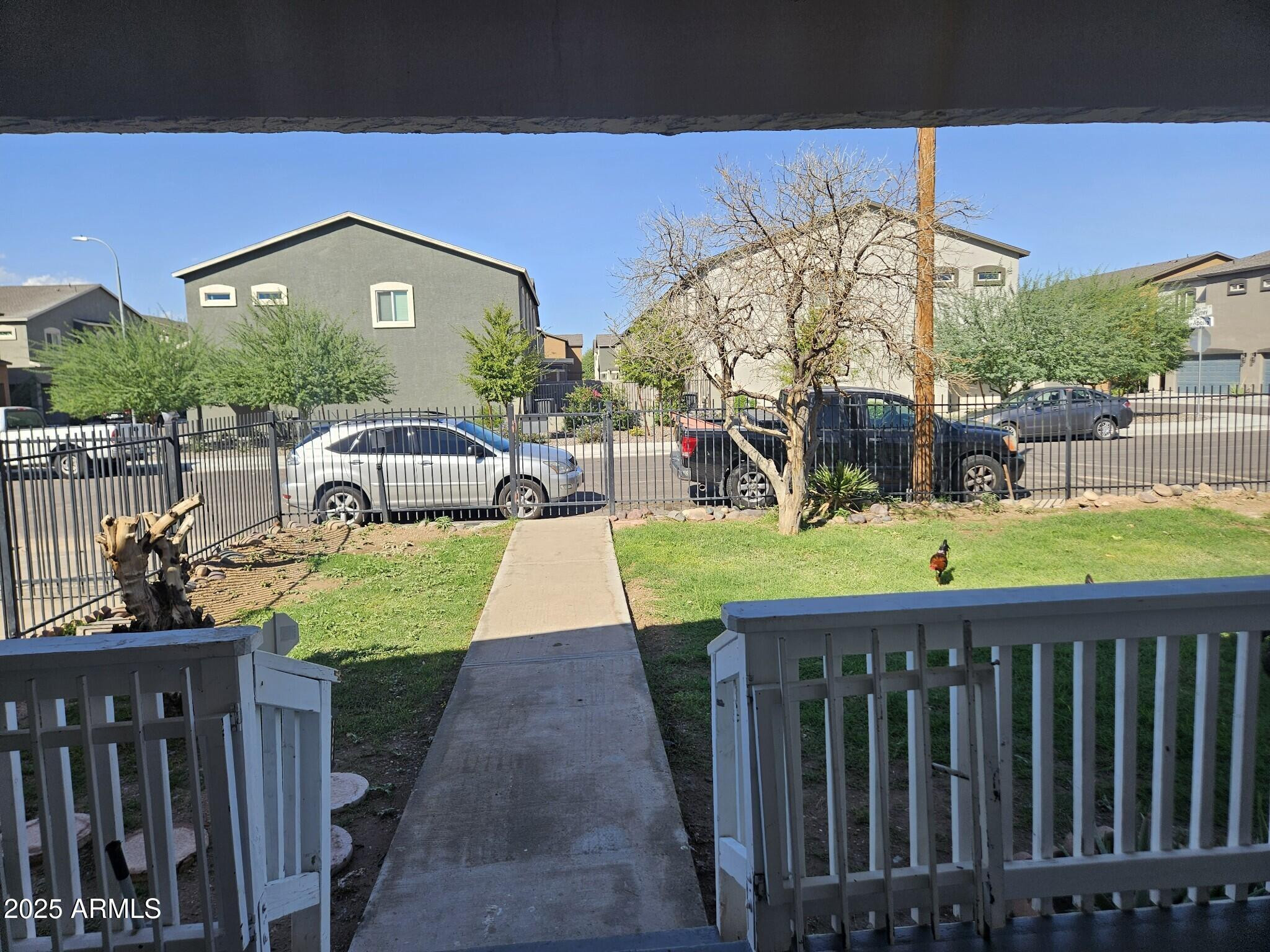 819 East Apollo Road Phoenix, AZ 85042 - Photo 3 of 17 a view of a house with a yard and table