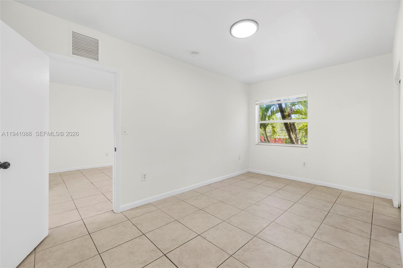 575 Northeast 82nd Street, Unit 10 Miami, FL 33138 - Photo 11 of 14 an empty room with windows