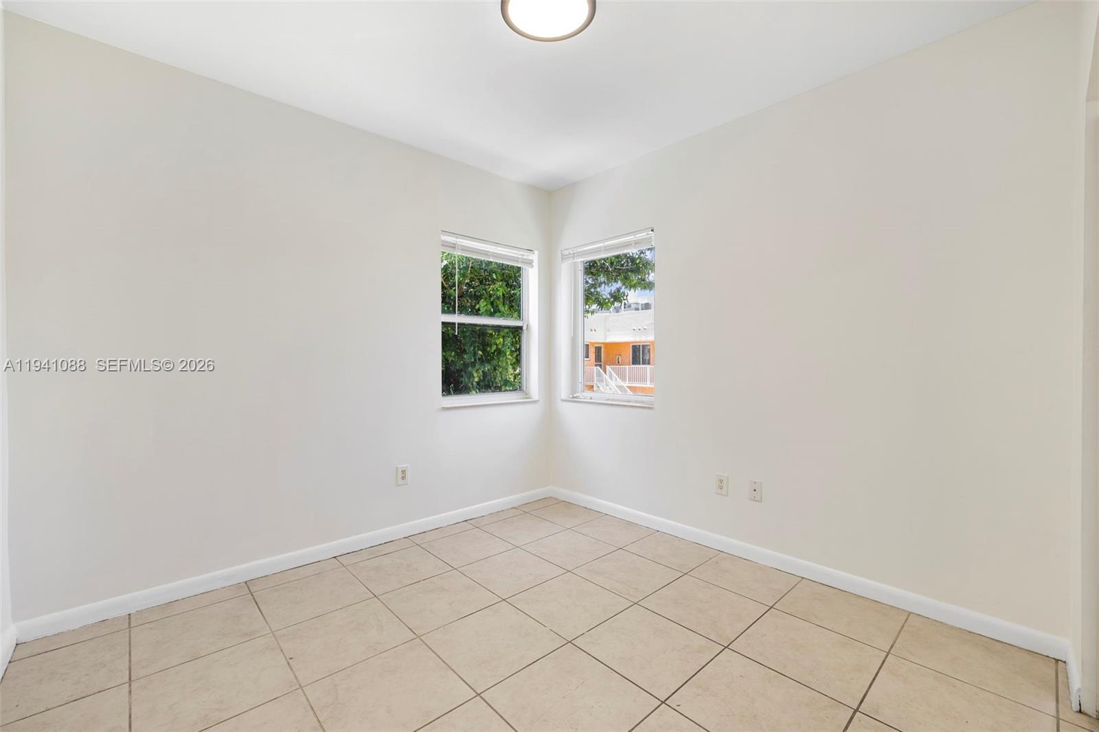 575 Northeast 82nd Street, Unit 10 Miami, FL 33138 - Photo 12 of 14 an empty room with windows