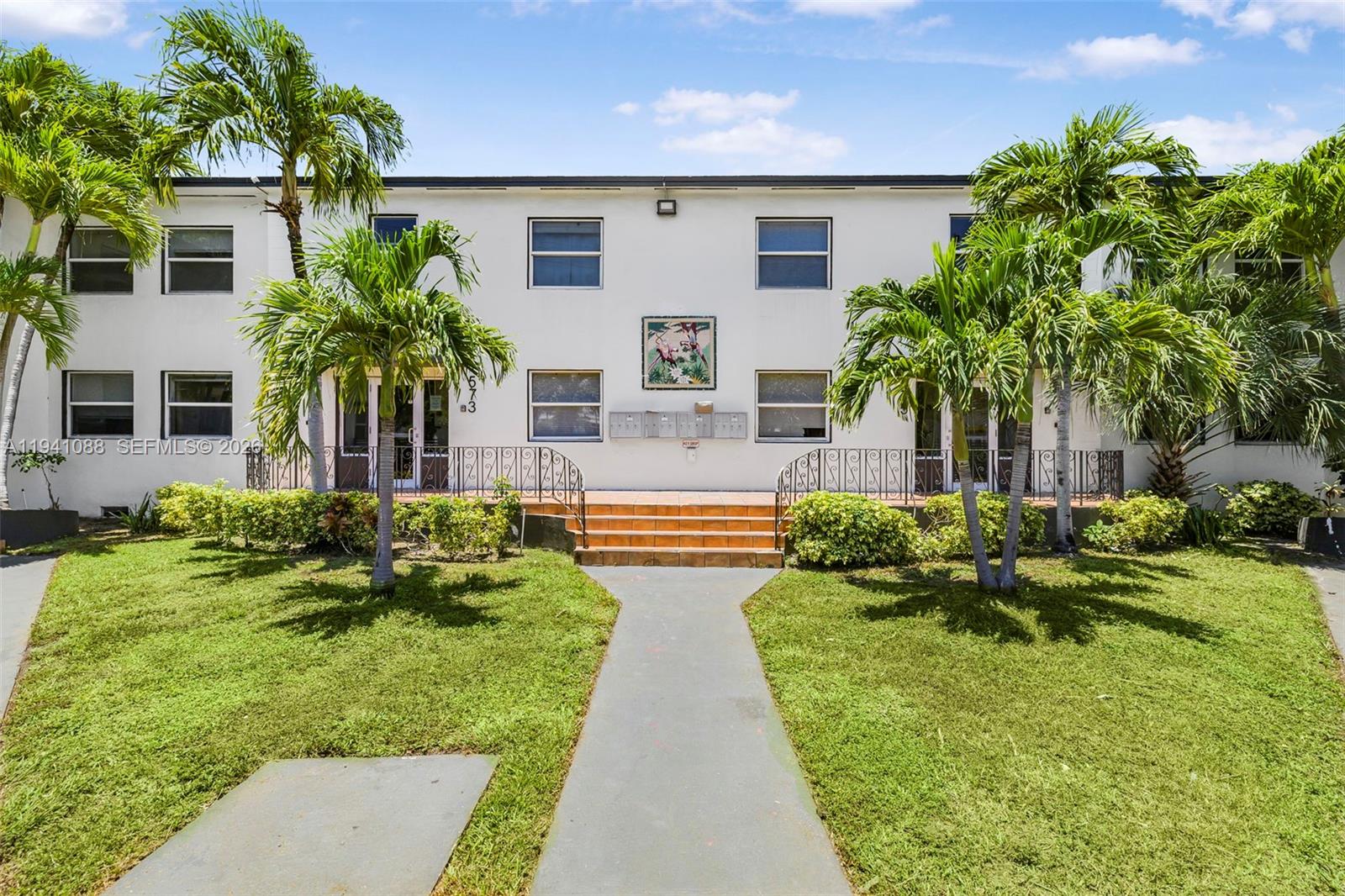 575 Northeast 82nd Street, Unit 10 Miami, FL 33138 - Photo 3 of 14 a front view of house with yard and green space