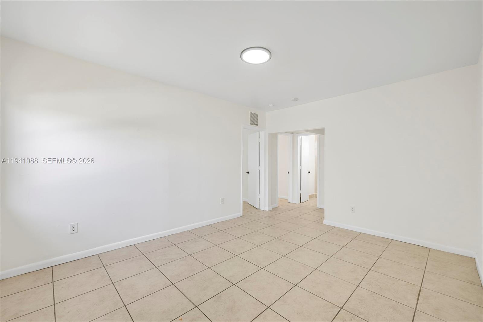 575 Northeast 82nd Street, Unit 10 Miami, FL 33138 - Photo 8 of 14 a view of an empty room and window