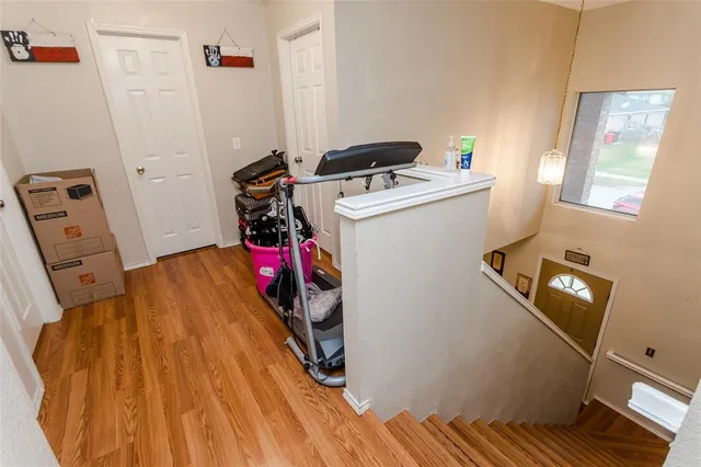 a utility room with dryer washer and a view of living room
