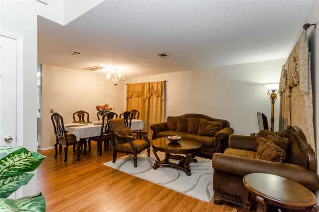 a living room with lots of furniture and a rug