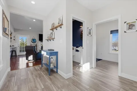 a view of a living room kitchen and a wooden floor