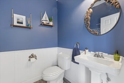 a bathroom with a toilet and a sink