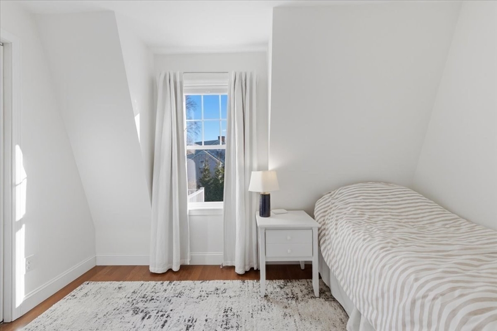 27 Curtis Street Scituate, MA 02066 - Photo 29 of 40 a bedroom with a bed and a window