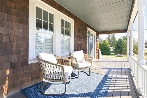 a balcony with view of the house