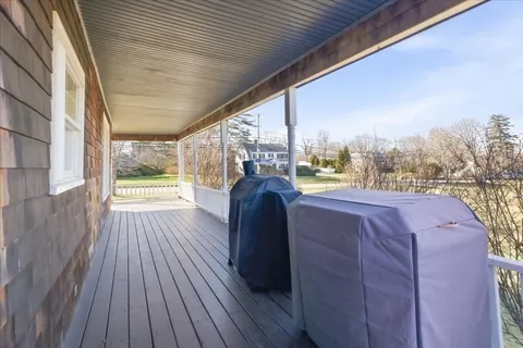 a view of a balcony with wooden floor