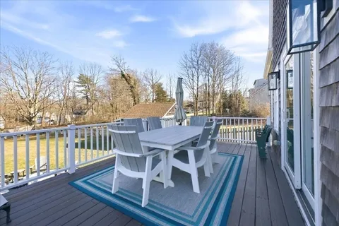 a house view with a swimming pool and garden
