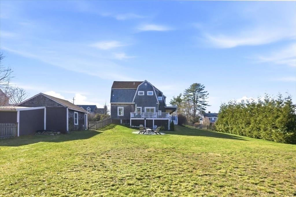 27 Curtis Street Scituate, MA 02066 - Photo 35 of 40 a house view with a swimming pool and garden