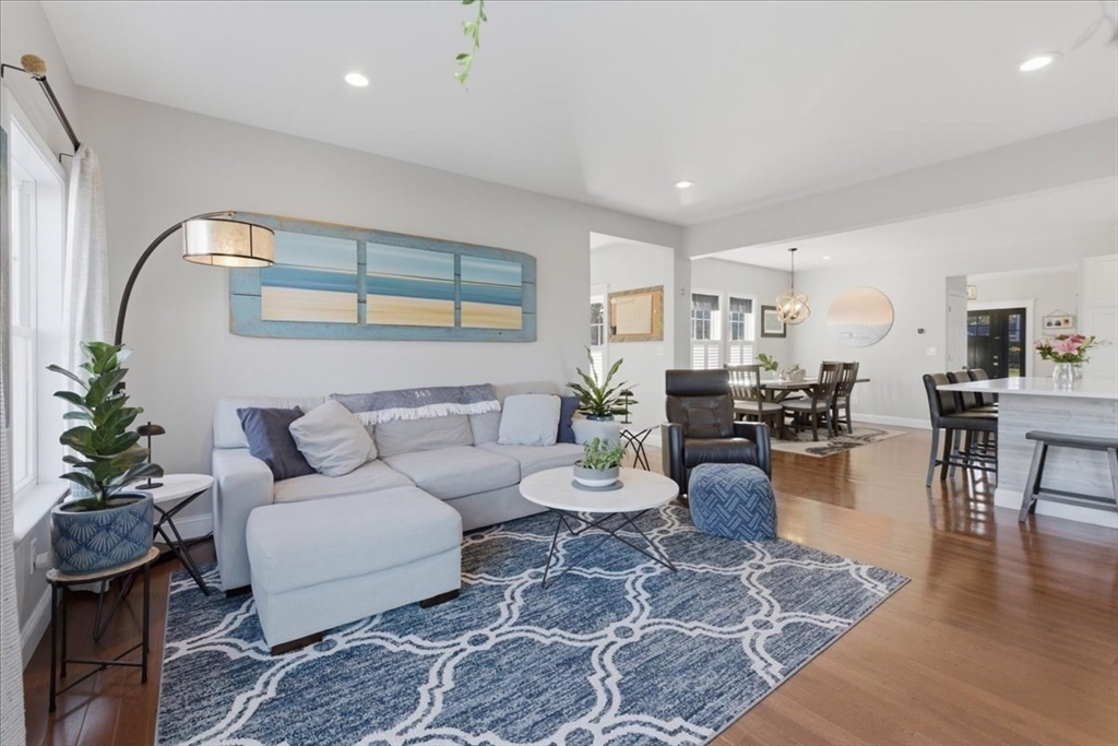 27 Curtis Street Scituate, MA 02066 - Photo 10 of 40 a living room with furniture and wooden floor