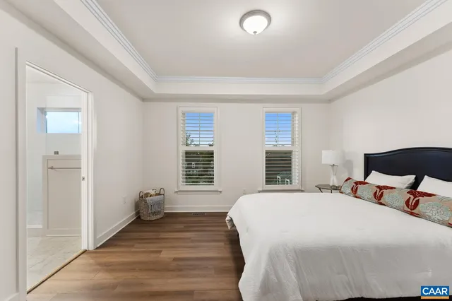 a bedroom with a bed and a chair