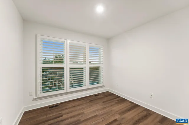 a view of a balcony with wooden floor