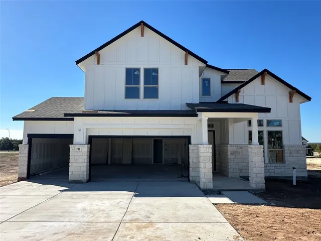 a front view of a house with garage