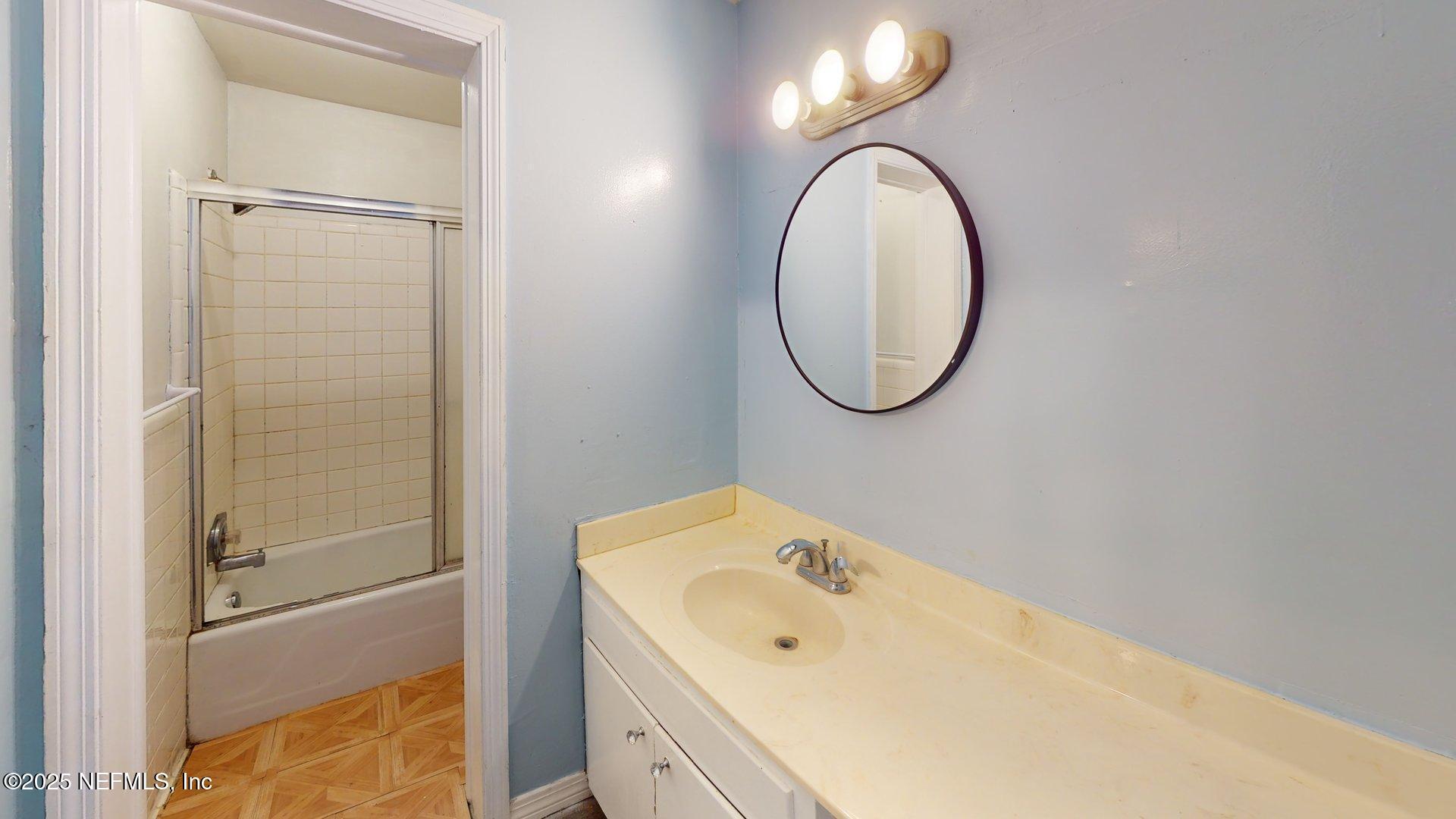 1540 El Prado Road, Unit 4 Jacksonville, FL 32216 - Photo 12 of 24 a bathroom with a sink and a mirror