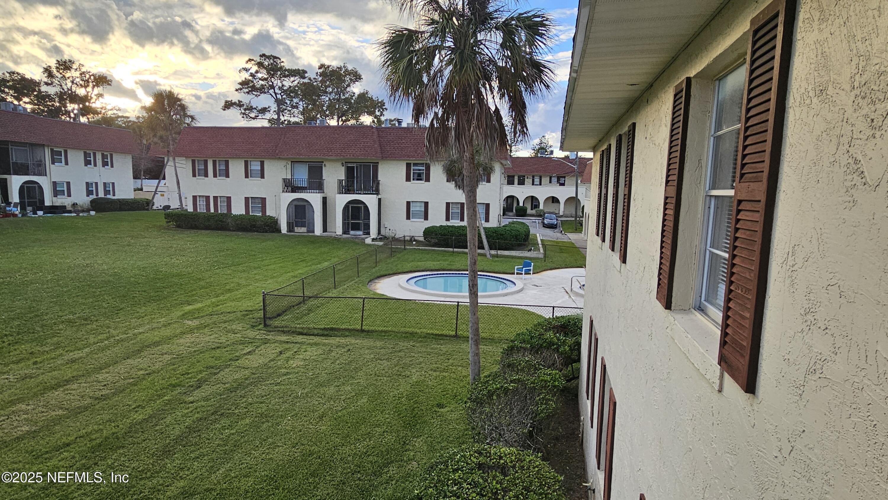 1540 El Prado Road, Unit 4 Jacksonville, FL 32216 - Photo 21 of 24 a view of a house with a yard table and chairs