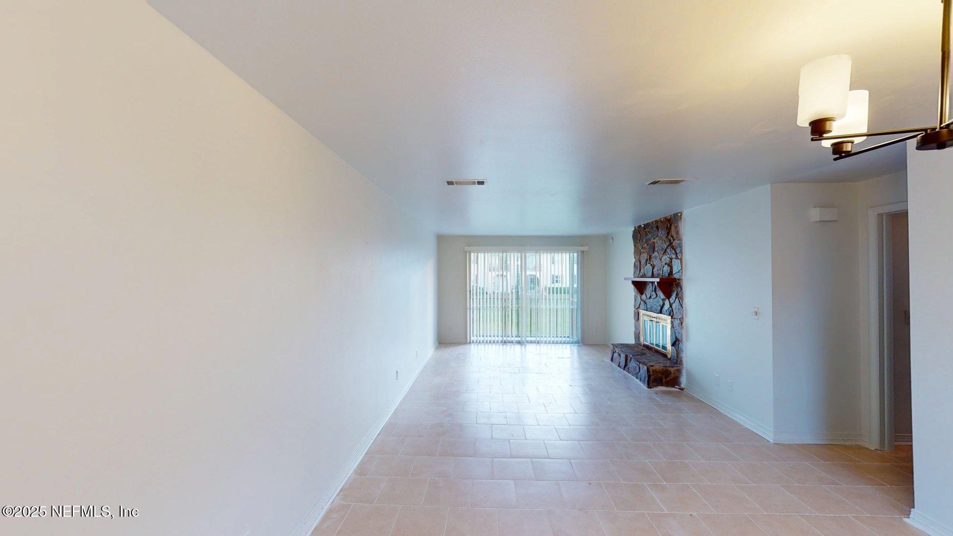 1540 El Prado Road, Unit 4 Jacksonville, FL 32216 - Photo 6 of 24 a view of hallway with a window and a kitchen