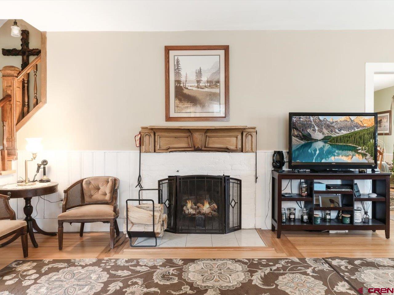 15318 6100th Road Montrose, CO 81403 - Photo 11 of 35 a living room with furniture and a fireplace