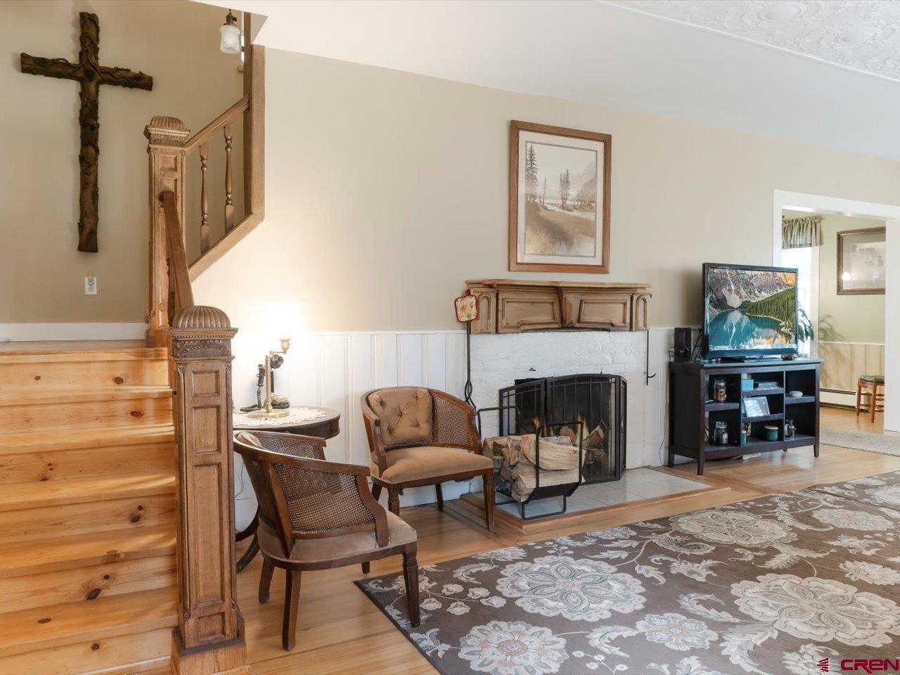 15318 6100th Road Montrose, CO 81403 - Photo 12 of 35 a living room with furniture and a fireplace