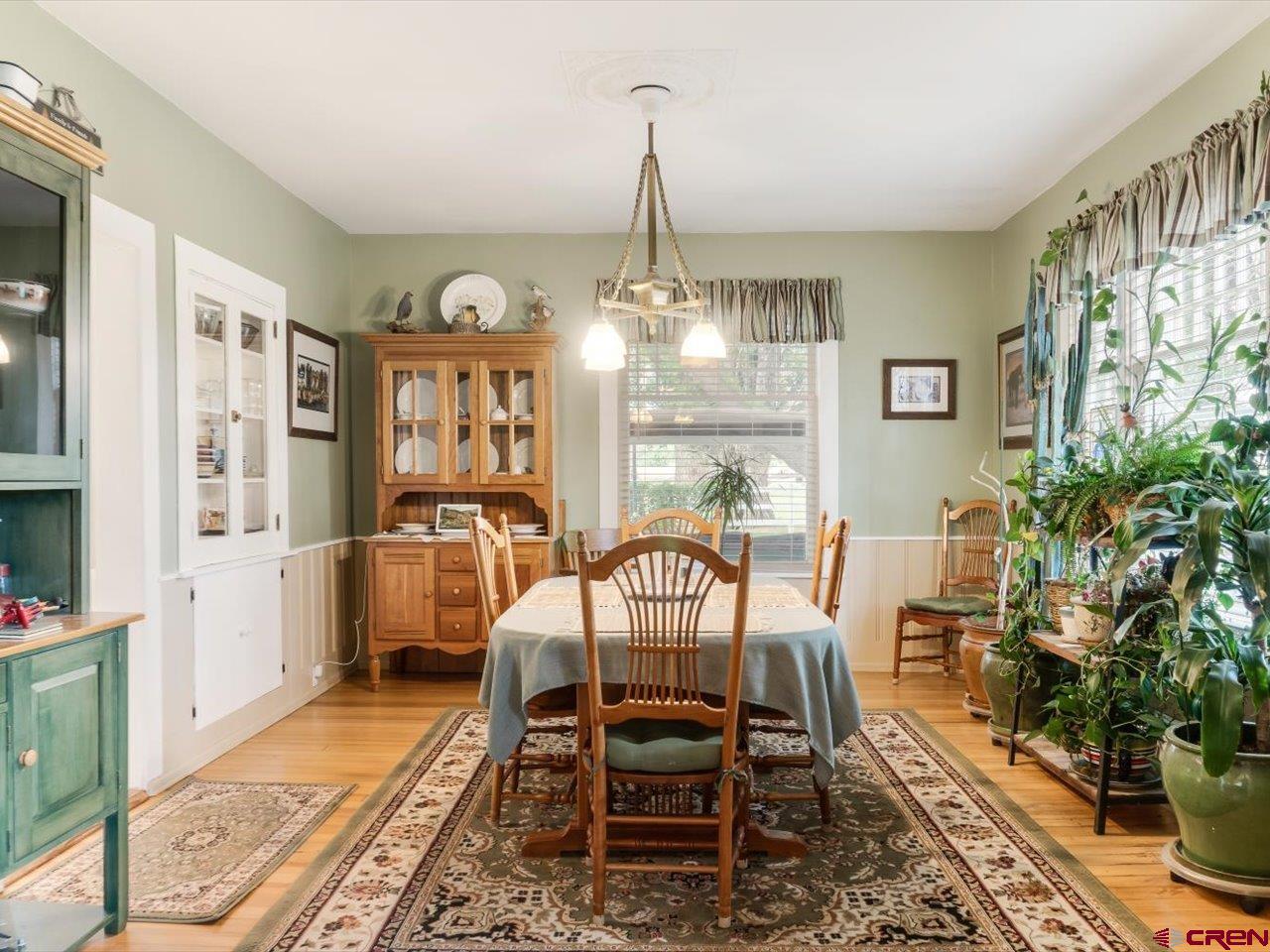 15318 6100th Road Montrose, CO 81403 - Photo 13 of 35 a view of a dining room with furniture window and wooden floor
